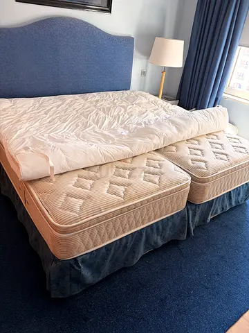 King size bed (2 mattresses 1m each) with toppemattress with base and headboard - like new condition