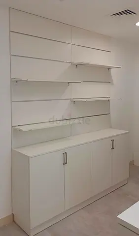 Wall-mounted display shelving unit with base cabinet Custom Made