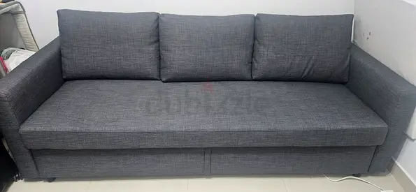 Gray 3-seater Sofa Bed in Good Condition — Solid Fabric, Modern Design (IKEA)