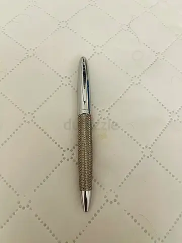 Silver metal ballpoint pen with textured grip - used