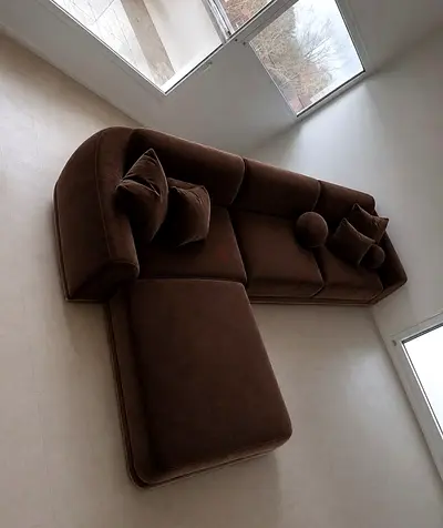 Brown L-shaped sectional sofa with chaise