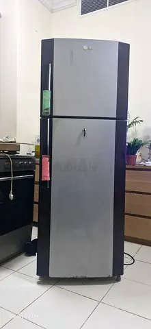 Used double-door refrigerator.