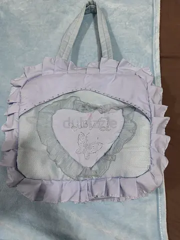 Light purple baby diaper/portable changing bag with ruffles