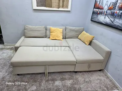 Beige L-shaped Sofa Bed with Storage - Good Condition