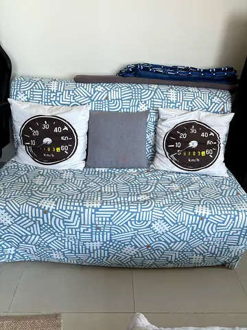 Light blue patterned 2-seater sofa bed in excellent condition
