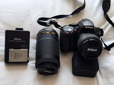 Nikon D5300 DSLR with 18-55mm and 55-200mm lenses + charger