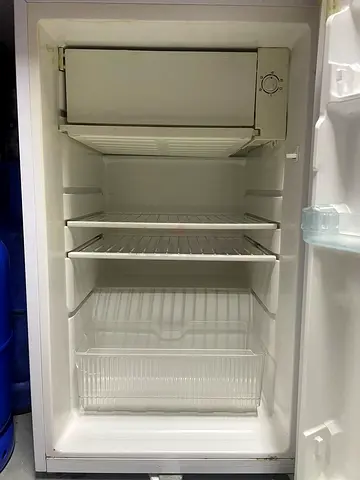 Used single-door refrigerator with small freezer compartment - working condition