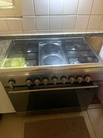 Stainless Steel 4-Burner and 2 electric Bompany Gas Cooker with Oven - Good Condition
