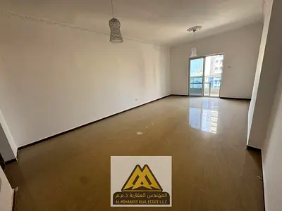 2BR in Al Nuaimiya 3, central AC, balcony and free parking. AED 46,000 yearly, 4 payments.