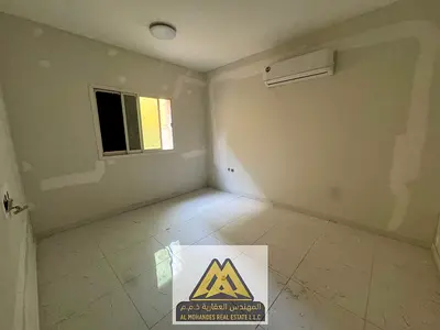 Spacious 1BR on the ground floor in Al Rawda 3, Ajman, split AC. AED 29,005 yearly.