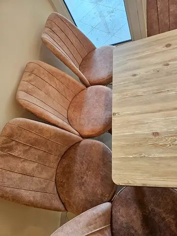Wooden dining table with 6 brown upholstered chairs - good condition