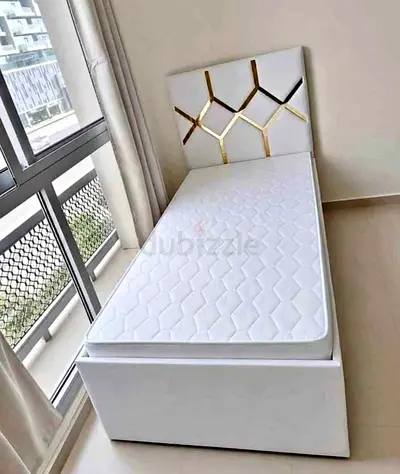 Single white bed with storage and modern geometric headboard