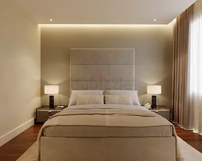 King size upholstered bed with padded headboard in beige