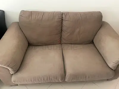 2-seater beige fabric sofa in good used condition for free
