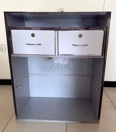 Small metal storage cabinet with two lockable drawers
