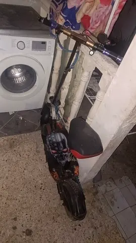 Used electric scooter with seat — good for kids/commute