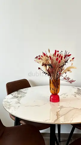 White round table with 4 brown chairs