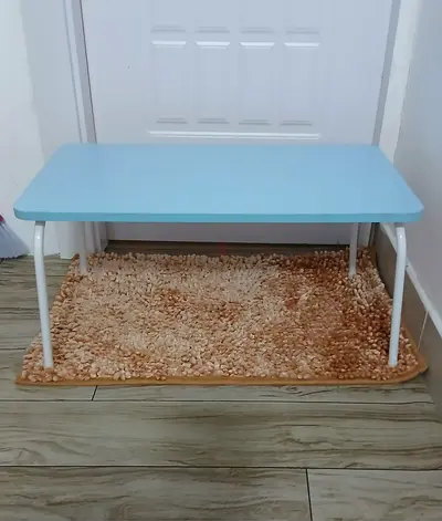 Light blue folding table with white legs - good condition