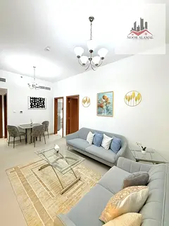 Furnished apartment in Liwan, Dubai, featuring a hotel-style interior. It includes a bedroom, a livi