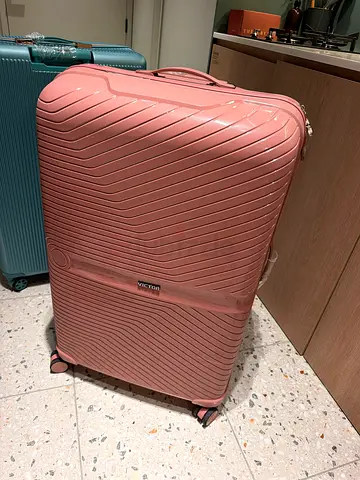 Large pink hard-shell roller luggage suitcase - good condition