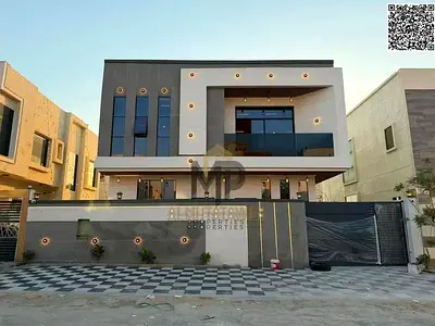 A modern villa for sale, featuring luxurious finishes and high-end contemporary specifications. Registration fees are included. The property is situat