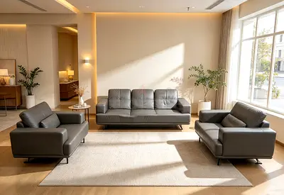 Modern grey leather 3-seater sofa with two matching armchairs - excellent condition