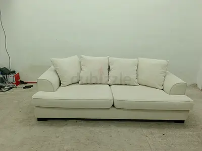The one brand beige color 3 seater sofa