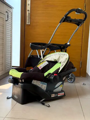 Infant car seat with base, plus an additional base with wheels
