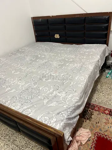 Wooden double bed frame with padded headboard - good condition