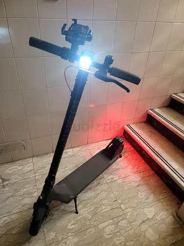 Electric Scooter in Good Working Condition with Front Light and Rear Brake Light