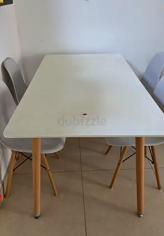 White rectangular dining table with wooden legs - good condition