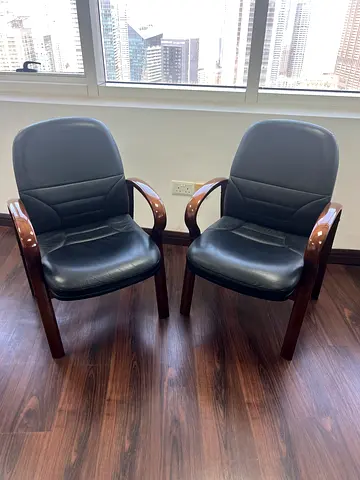 Pair of Leather Visitor Chairs with Wooden Arms – AED150