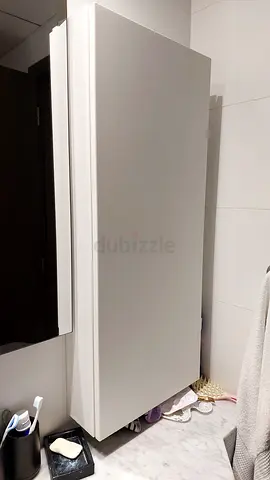 Tall white single-door storage cabinet - good condition
