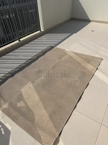 Neutral beige outdoor rug - good used condition