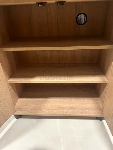 Light oak wooden cabinet/shelf unit with multiple compartments