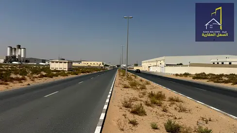 Industrial land plot for sale in a prime location, accessible from both the front and back via 36-meter and 24-meter wide roads, situated in Emirates