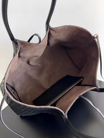 Large black leather tote bag with suede interior