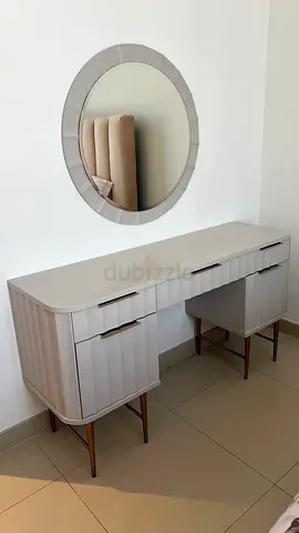 Modern beige dressing table with round mirror and stool