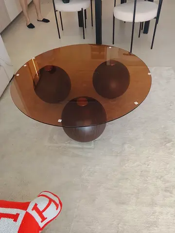 Round smoked glass coffee table with  spherical base