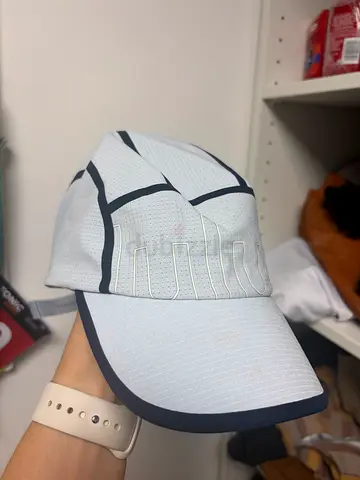 Light colored Lululemon running cap with reflective details - worn once