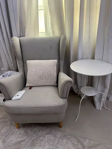 Light grey wingback armchair with ottoman - modern, good condition
