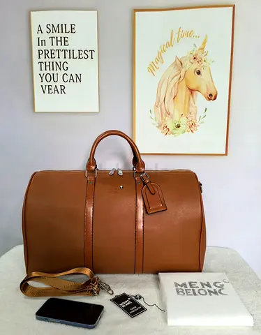 Brown leather duffel travel bag with shoulder strap