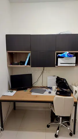 IKEA style office desk with wall-mounted storage and chair - good condition.