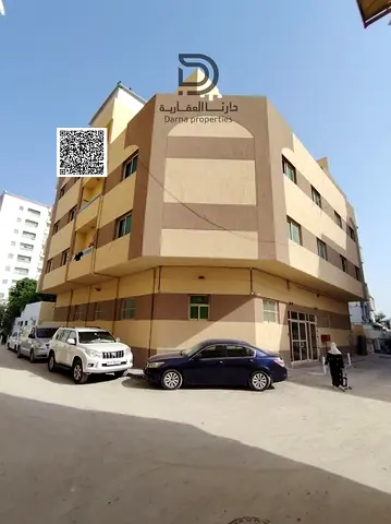Residential Investment Building for Sale in Al Rumailah, Ajman, Corner Plot Facing Two Streets, 22 Units, Annual Income AED 493,500, Negotiable Price