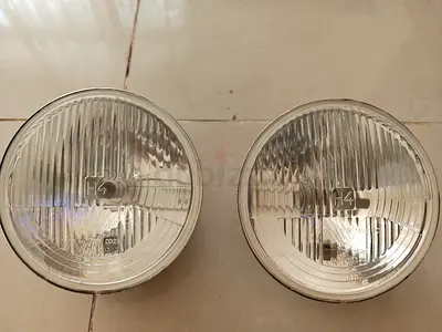 Genuine HELLA 7" (178mm) Round H4 Headlights for Jeep Wrangler JK - Pair for sale