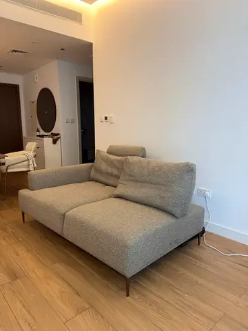 Modern 2-seater Fabric Sofa in Light Grey - Good Condition. Adjustable seats