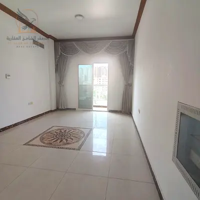 غرفة وصالة  مع بلكون وتكييف مركزي للإيجار في الراشدية 3 عجمان خلف جراند مول