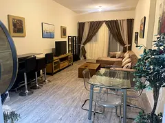 Furnished one-bedroom apartment with a living room for monthly rent in Ajman – Al Rashidiya – Aj
