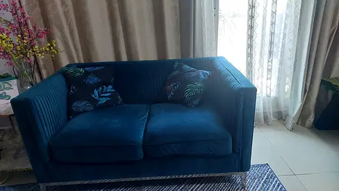 Green Velvet 2 seater velvet sofa bought from Danube is on sale at a very reasonable price