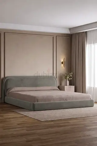Low-profile upholstered king bed with padded headboard